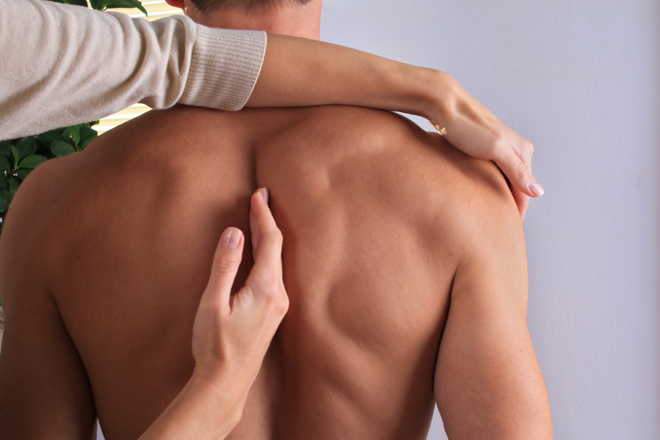 Man having chiropractic back adjustment close up