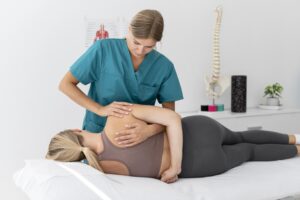 A female chiropractor providing chiropractic care
